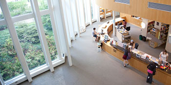 A bird's eye view of the circulation desk in the campus library.