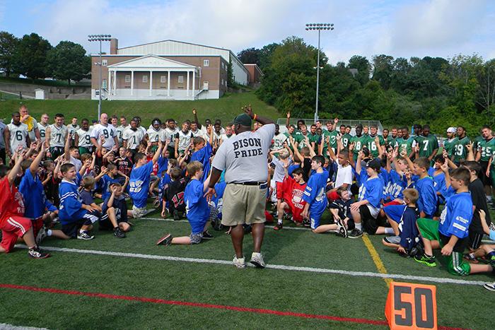 Coach Kevin Loney ’99 leads a summer football clinic at Nichols College in Dudley, Mass.