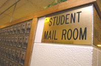 Photograph of HUB mailboxes and mail room sign
