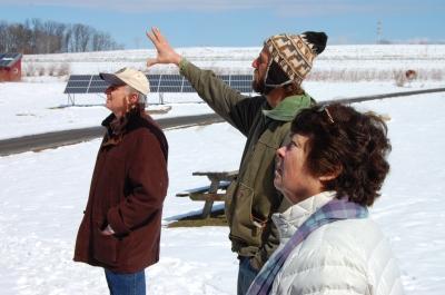 Picture of David Orr and his wife on a tour of the college farm, led by Matt Steiman
