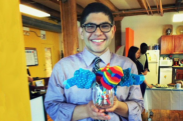 Nick Rejebian '17 poses with a creative goodbye present--a sock bouquet--at the close of his summer internship.