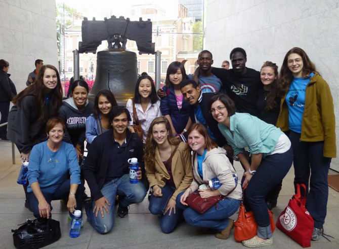 A group of Dickinson students and staff posing in front of the Liberty Bell.