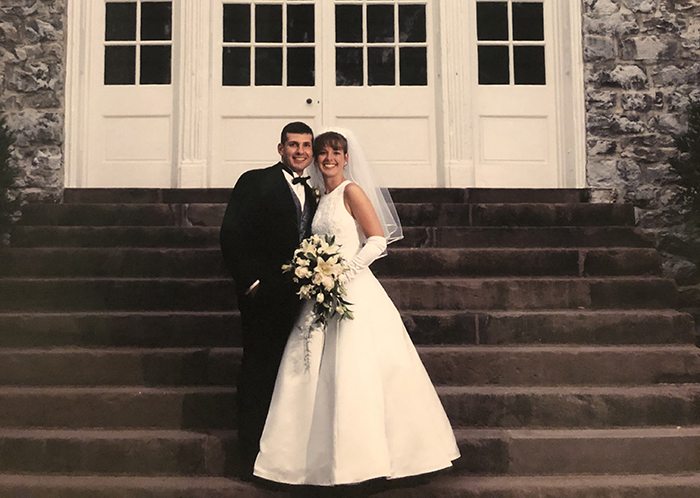 Spyro Karetsos '96 and Laura Otten Karetsos '96, on the steps of Old West on their wedding day.