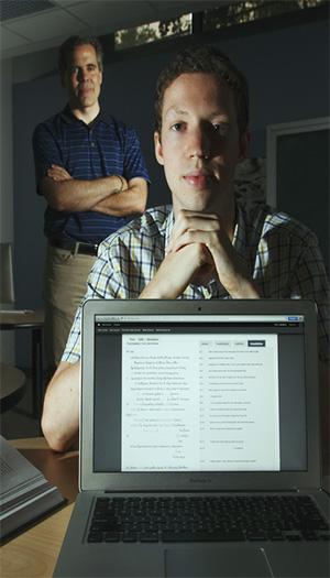 Asbury J. Clarke Professor of Classical Studies Christopher Francese and Nick Stender '15 pose behind a laptop displaying Stender's vocabulary lists for the 
