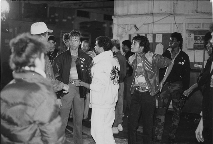 Vincent Paterson (facing camera, first from left) and Michael Jackson (right) on the set of "Beat It."
