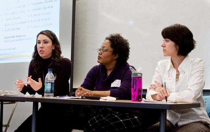 Female students participating in a panel discussion