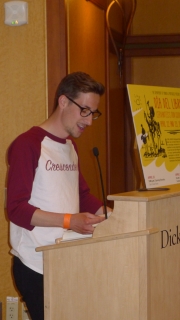 Aaron Hock '15 reads in English after singing with the Crescendevils at the closing dinner