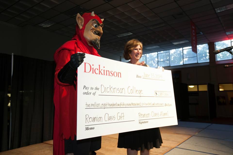 The Red Devil presents the reunion-class gift total to Marsh Ray, ice president for college advancement. Photo by Carl Socolow '77.