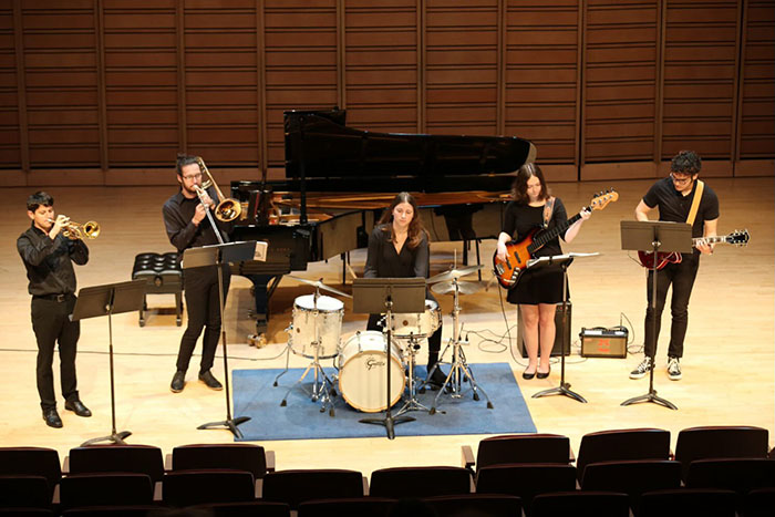 Dickinson students perform on stage.