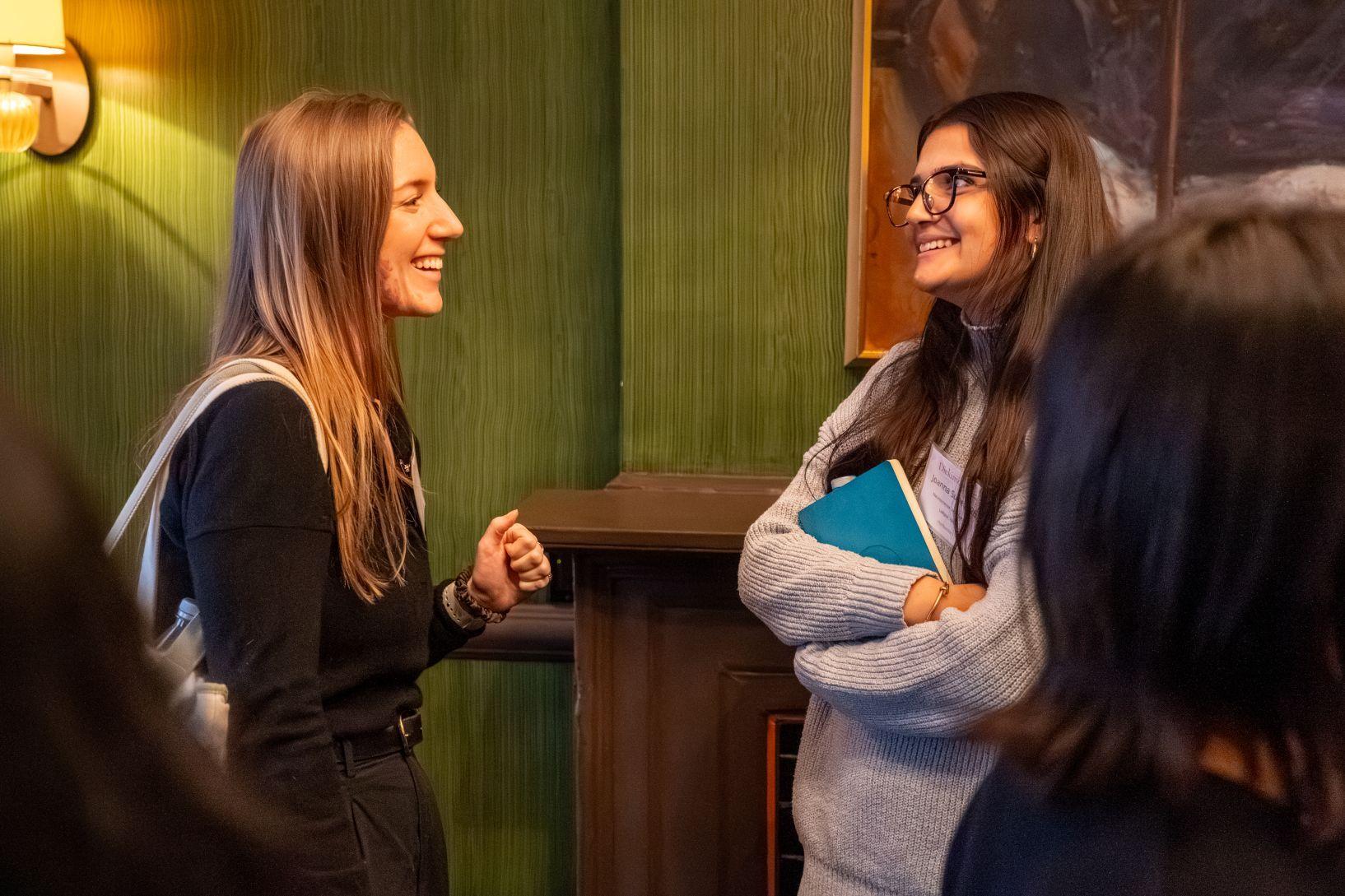 Two students talk during a site visit 