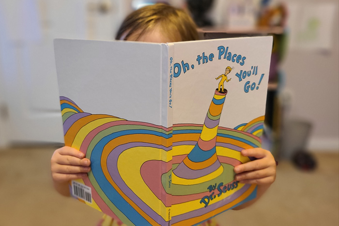 Child reading a book.