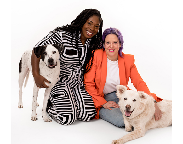 Lauren Ashley Smith '06 (left), Brooke Helburn and their two dogs. Photo by Charlie Nunn.