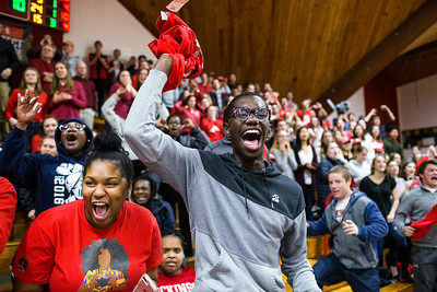 Students cheering at a Basketball game