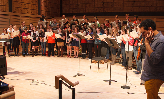 Mohammed Fairouz listens as the College Choir performs his oratorio, Anything Can Happen