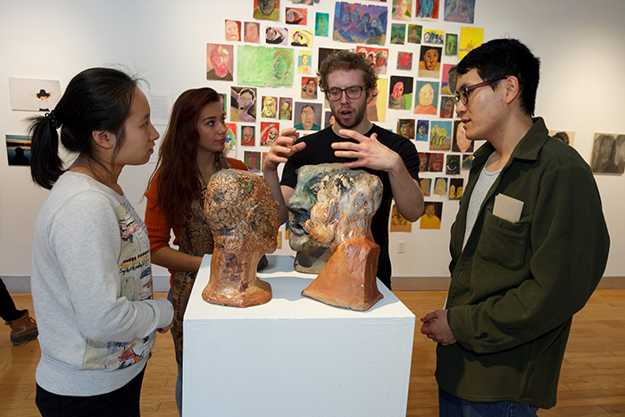 Senior studio art majors discussed their works in progress during last week's reception. The works draw from many different disciplines, including meteorology, music, psychology, sociology and neuroscience. Photo by Carl Socolow '77.