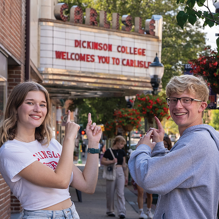 Two students point out the Carlisle Theater Marquee