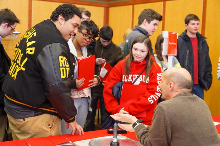 Future members of the class of 2018 visit the physics table at the Academic Open House.