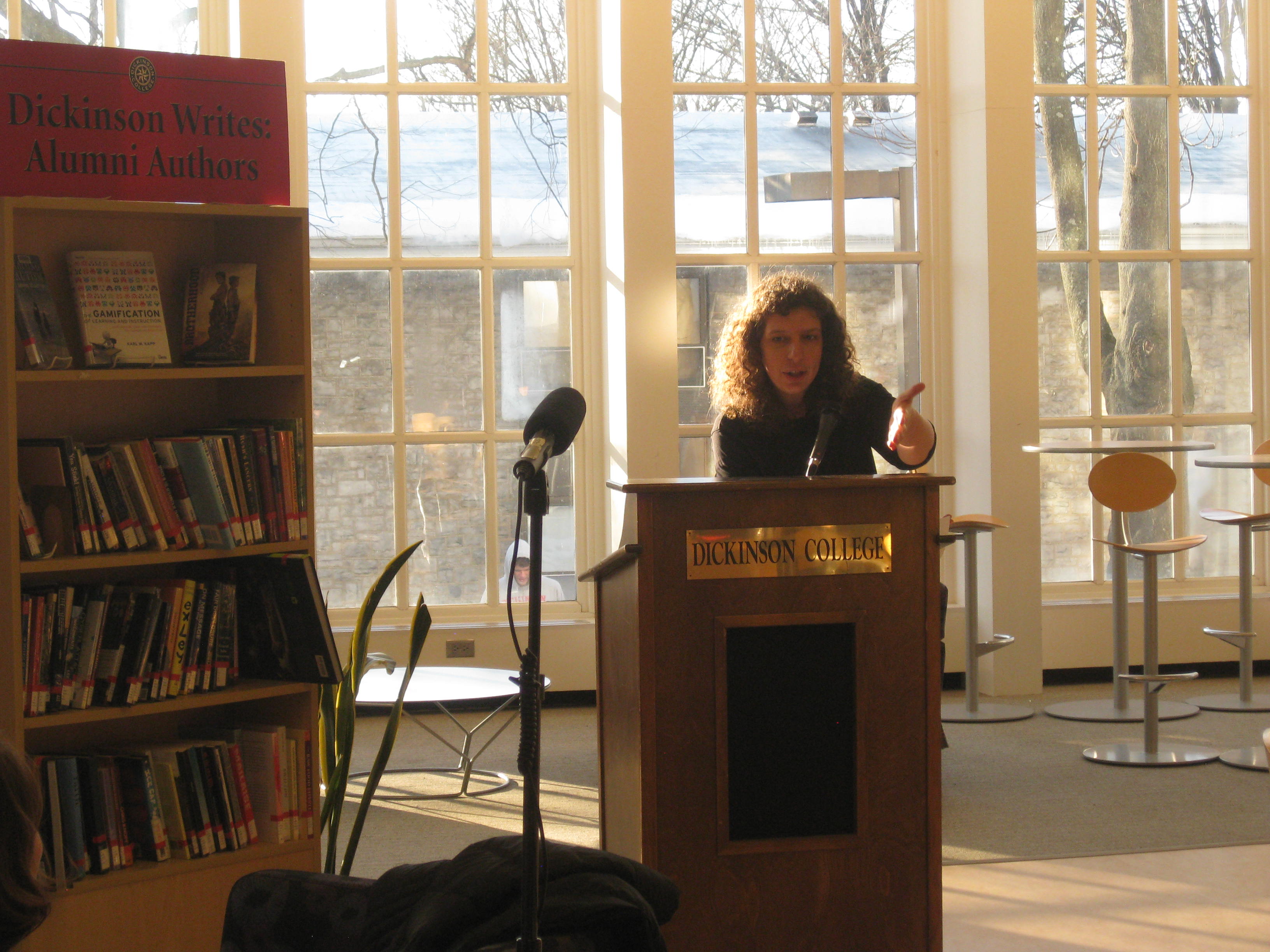 Photo of Russian poet Polina Barskova in the Biblio Café reading her poetry.