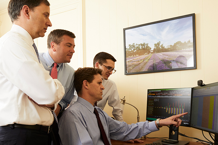 Men at a computer working