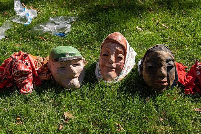 No, those aren&#039;t prehistoric creatures, rising up from the Earth. They&#039;re puppet heads, soaking up the ambiance at the College Farm. Photo by Dan Loh.