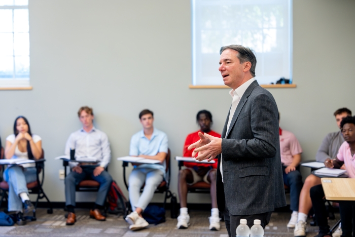 Capone shares insights with students during a visit to the college's Profiles in Leadership course. In addition to mentoring students through opportunities like this, Capone serves on the college's Board of Trustees. Photo by Joe O'Neill.