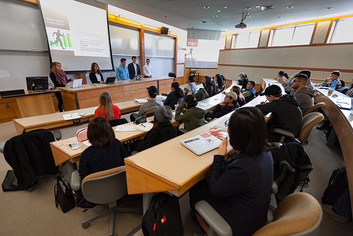 Students in an introductory course deliver original research to aid local small-business owners. Photo by Carl Socolow '77.