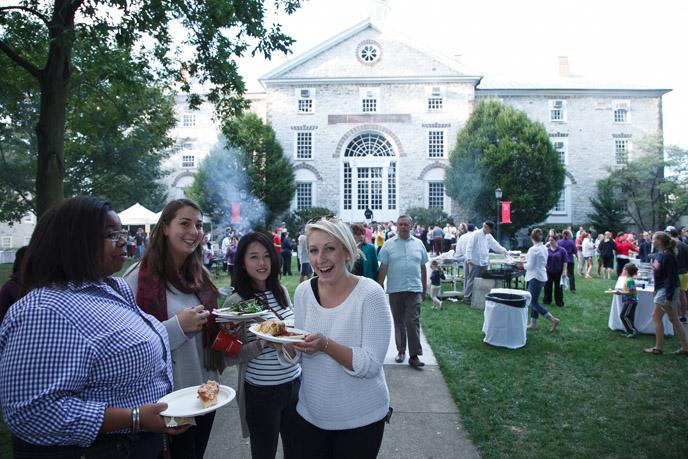 Students enjoy Charter Day picnic food.