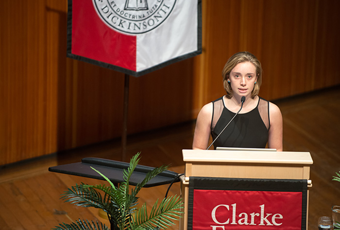 Nora Snee '15 introduces a guest speaker during a Clarke Forum event.