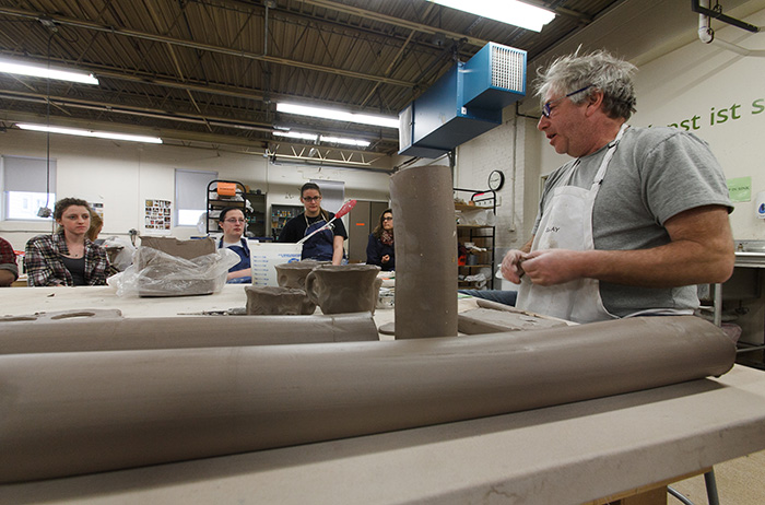 Visiting artist Arnie Zimmerman P'14 gives a ceramics workshop. Photo by Carl Socolow '77.
