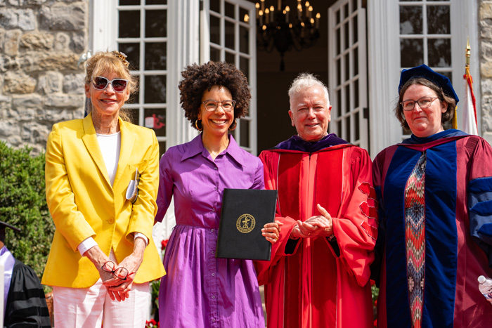 Julie Walters (left), Rose-Walters prize winner Ayana Elizabeth Johnson (second from left) and Constance and Rose Ganoe Memorial Award winner Emily Pawley (right) pose with President Jones. Photo by Dan Loh.
