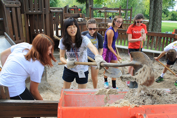 Students pitch in during a 2015 service event at a nearby park.