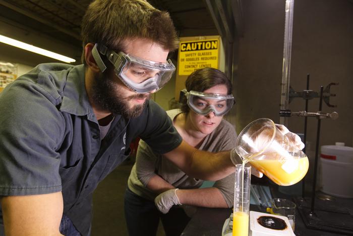 Students convert waste vegetable oil to biodiesel fuel.