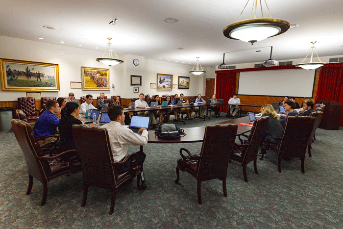 students around a conference table