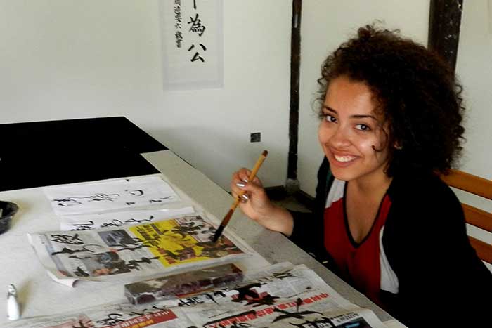 Nicole Price practices her Chinese characters