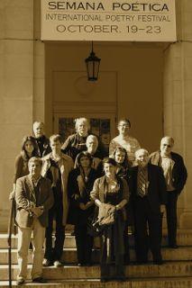 International poets gather for a photo in front of Bosler Hall for poetry week.