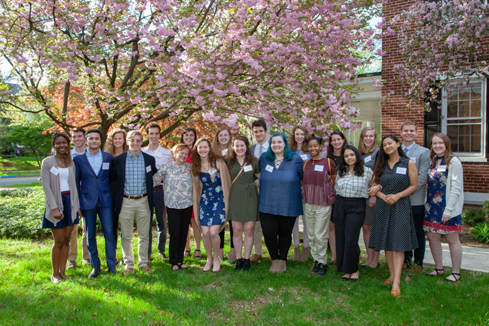 The student presidential fellows who will be conducting alumni interviews this summer pose with Dickinson College President Margee Ensign.