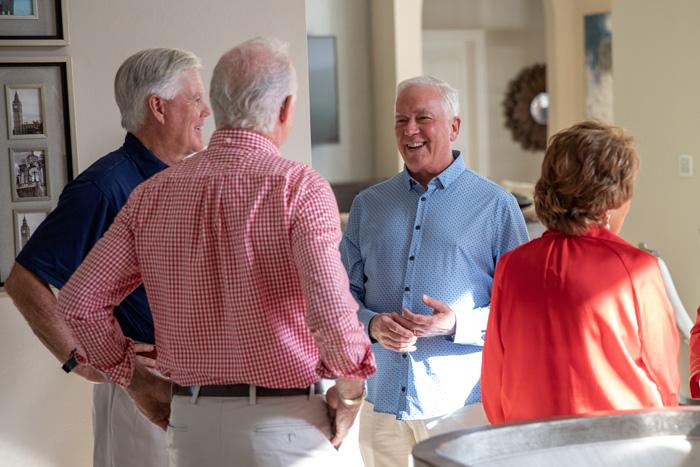 George Hager '78 and John E. Jones III ’77, P’11, welcome guests to the Naples, Florida, Dickinson Forward Tour stop.