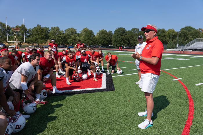 John E. Jones III '77, P'11, visits football practice.