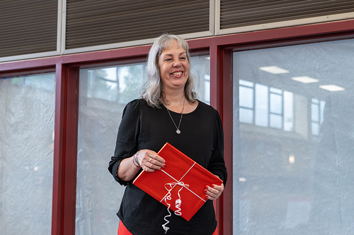Michelle Fisher accepts her Distinguished Staff Award. Photo by Dan Loh.