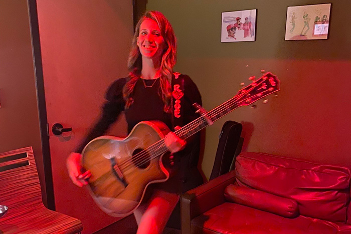 Emily keating with her guitar