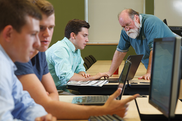 From left: Jake Milligan, David Erfle, John "Jay" Mayers '16 and Steve Erfle, associate professor of international business & management.