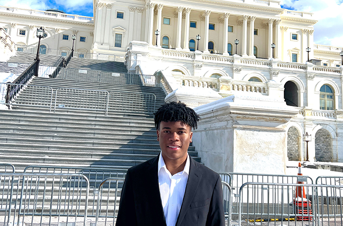 Ethan Barnes '26 in front of the capitol.