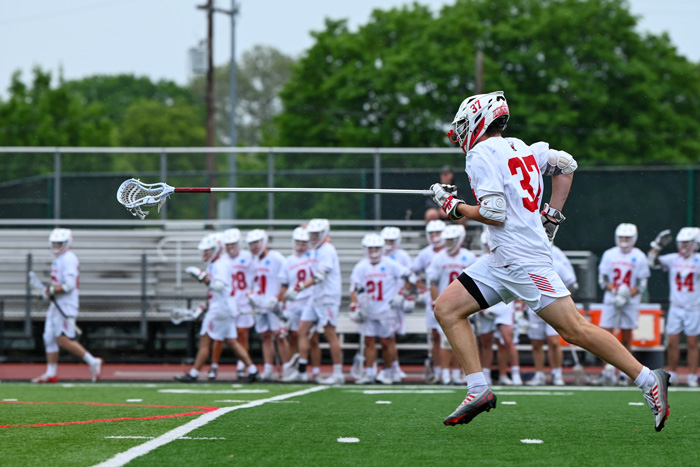 Evan Karetsos runs with the ball