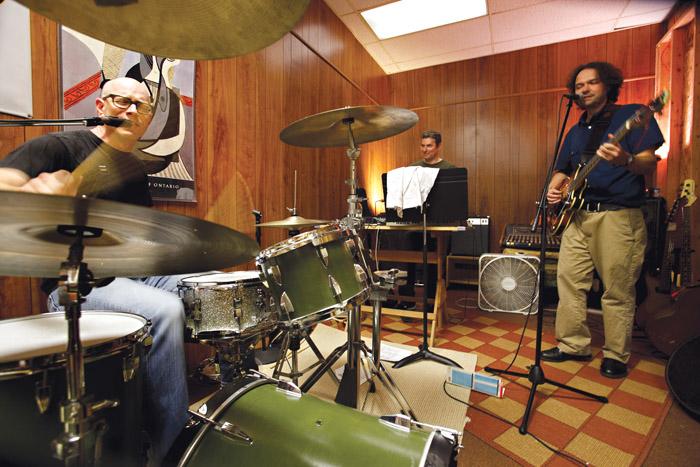 As far as instruments go, the members of the faculty band play "pretty much everything," and here we find Cotten Seiler on drums, Shawn Bender at the keyboard and Ed Webb on guitar. Photo by Carl Socolow '77.