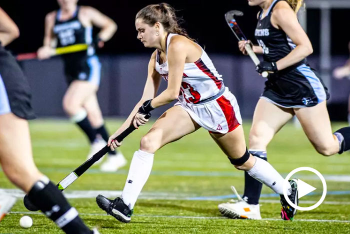 A player moves the ball down the field