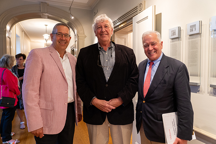 Honorees Doug Pauls '80 (left) and Jim Chambers '78 (center) pose with President Jones in Old West, where the Founders' Society plaques are on display. Photo by Dan Loh.