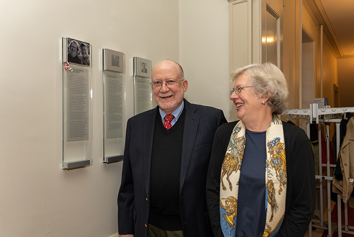 Neal Abraham '72 and Donna Wiley pose before the plaque in their honor. As a member of the Founders' Society, they are memorialized in a plaque in Old West. Photo by Dan Loh.
