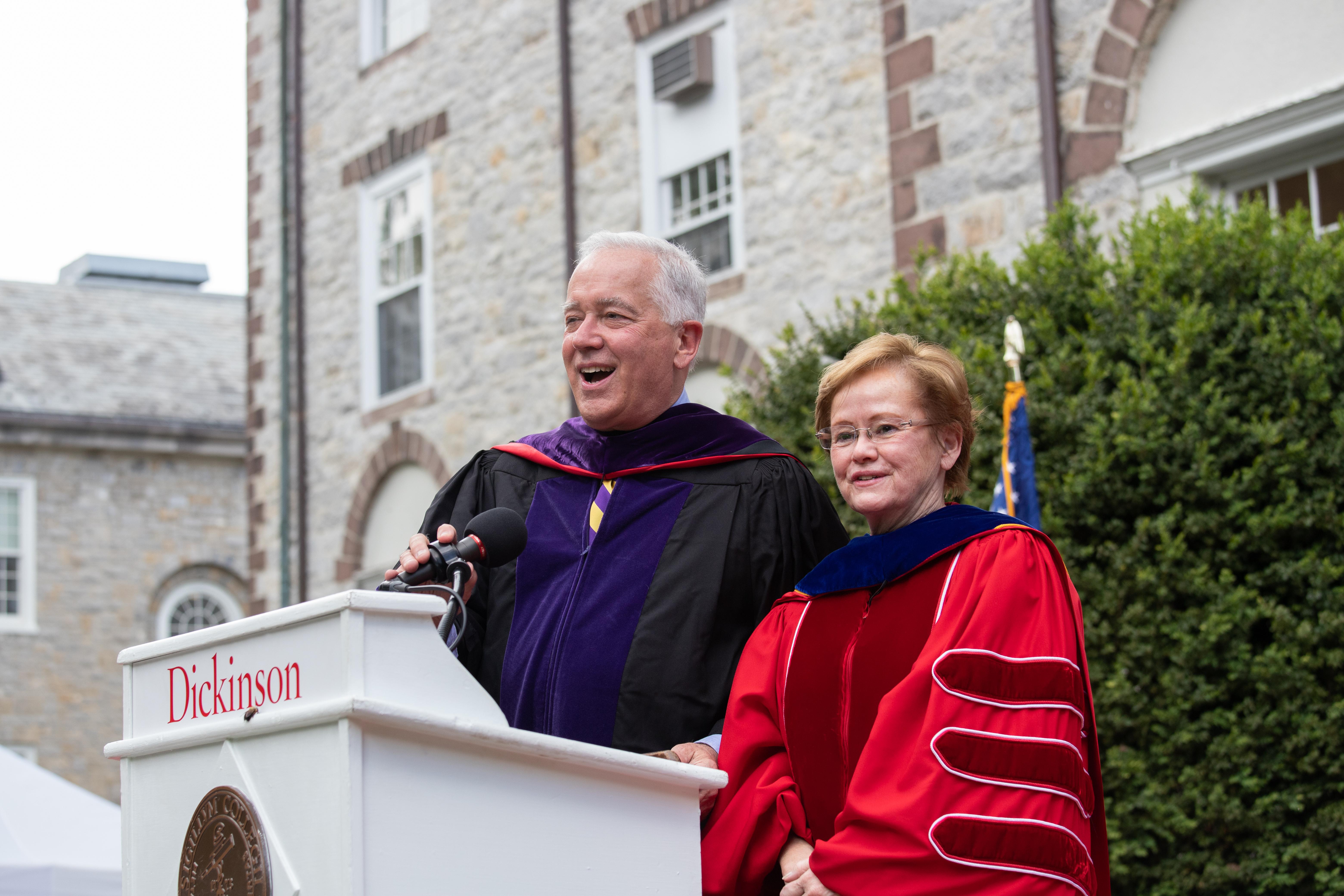 Photo of John Jones and Margee Ensign standing behind a podium.