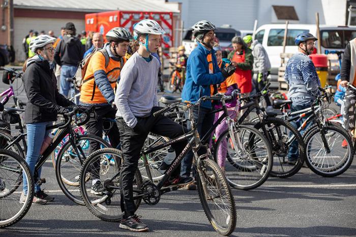 A group of people on bicycles.