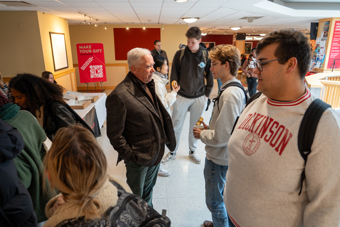 To celebrate Giving Tuesday on campus, students, faculty, staff and President John E. Jones III '77, P'11, gathered in the HUB for donuts and coffee from the Peddler. Photo by Dan Loh.